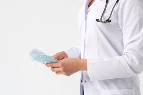 Doctor or nurse recommend to use protective face mask to protect from virus Stock Photos