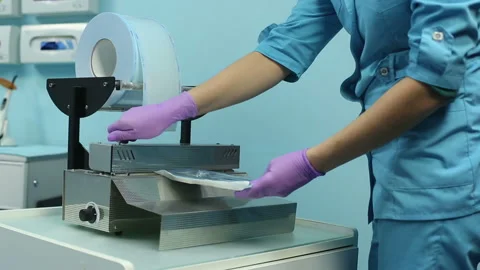 Doctor Is Packing Instruments In Special Plastic Bags Before Sterilization Stock Footage 86241050