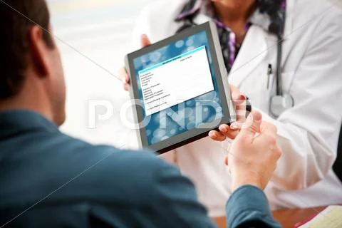 Doctor: patient needs to fill out medical form on tablet computer Stock Photos
