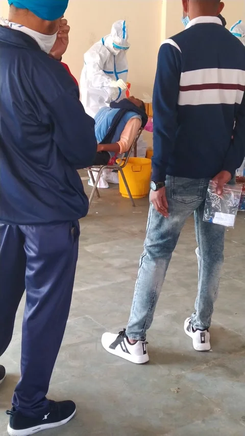 A doctor performing corona test and bearing PPE suit to conduct COVID 19 test. Stock Footage 145516539