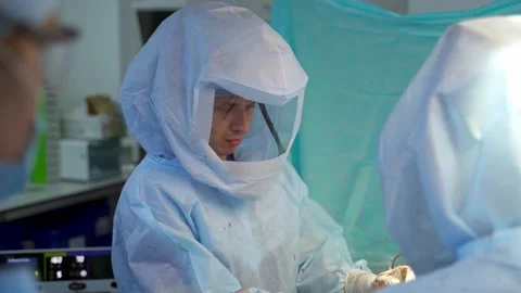 Doctor performing difficult surgery Stock Footage 135605597