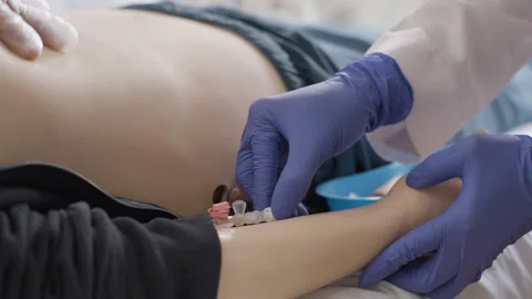 Doctor performing first aid and injection on dummy in medical clinic Video stock 270176536