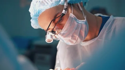 Doctor performing surgery Stock Footage 133033194