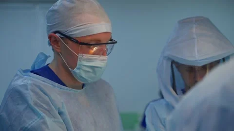 Doctor performing surgery Stock Footage 135605711