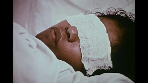 Doctor performs birth control operation on patient - 1974 Stock Footage