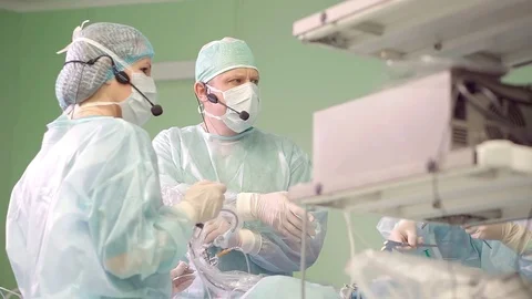 Doctor performs endoscopic surgery removing a brain tumor Stock Footage