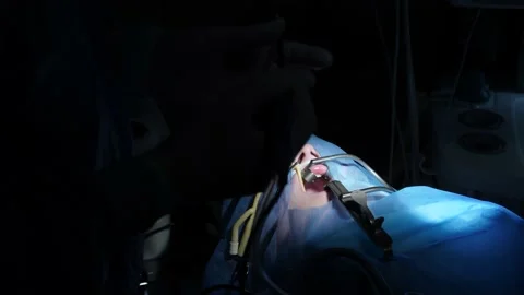 The doctor performs an operation on a child Stock Footage 155903338