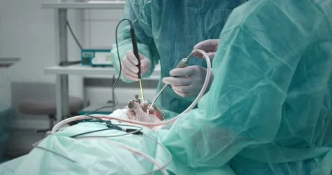 The doctor performs a pediatric surgical operation to remove the tonsils Stock Footage 163909677