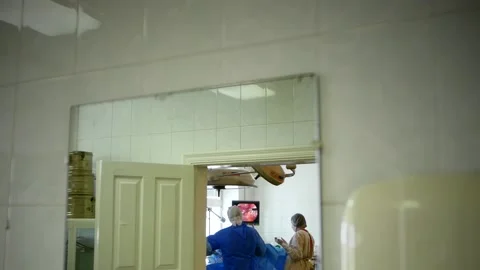 Doctor performs a surgical operation to remove the tumor Stock Footage 147534394