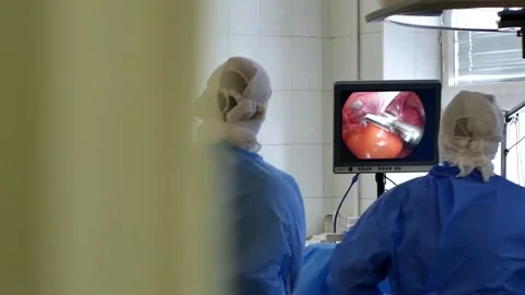 Doctor performs a surgical operation to remove the tumor Stock Footage 147534402
