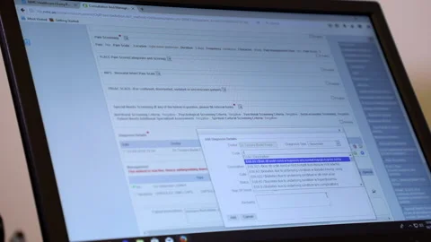 Doctor physician using computer writing notes consulting patient Stock Footage 146032278