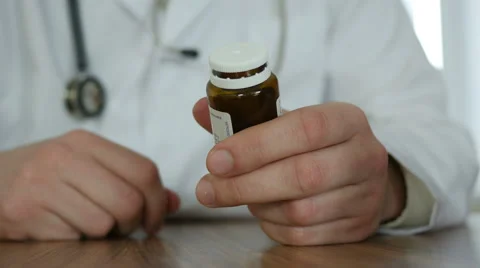 Doctor With Pills In Hands Stock Footage 64063643