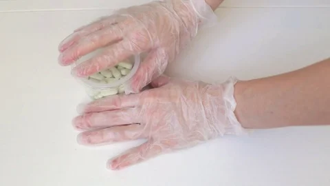 Doctor placing pills on table Stock Footage 71370050
