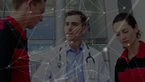 Doctor pointing, briefing two medics in atrium, clipboard, network overlay Stock Footage 332901970