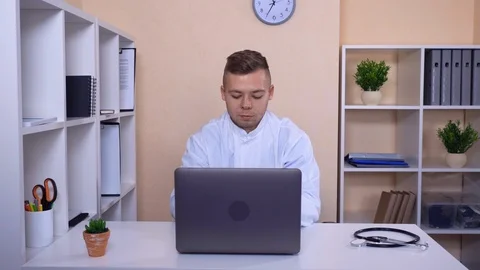 Doctor posing at work Stock Footage 86320644
