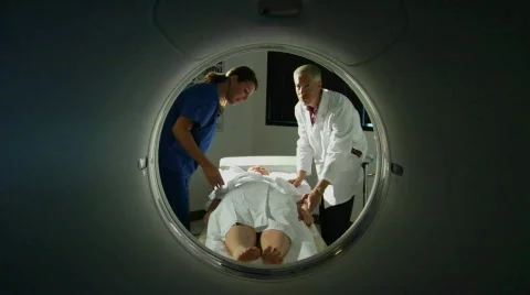 A doctor prepares a patient for a CAT scan. Stock Footage
