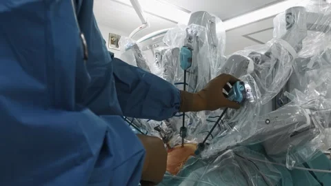Doctor prepares patient for surgery using advanced medical equipment Stock Footage 242367619