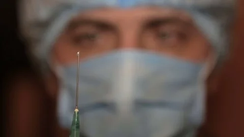 Doctor preparing to inject. Full hd video Stock Footage 73442009
