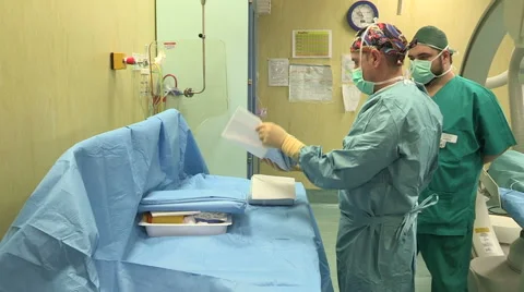 Doctor preparing instruments for surgical operation Stock Footage 45899880