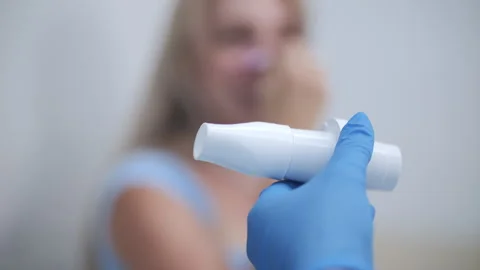 Doctor preparing spirometer for lung function test Stock Footage 314137772