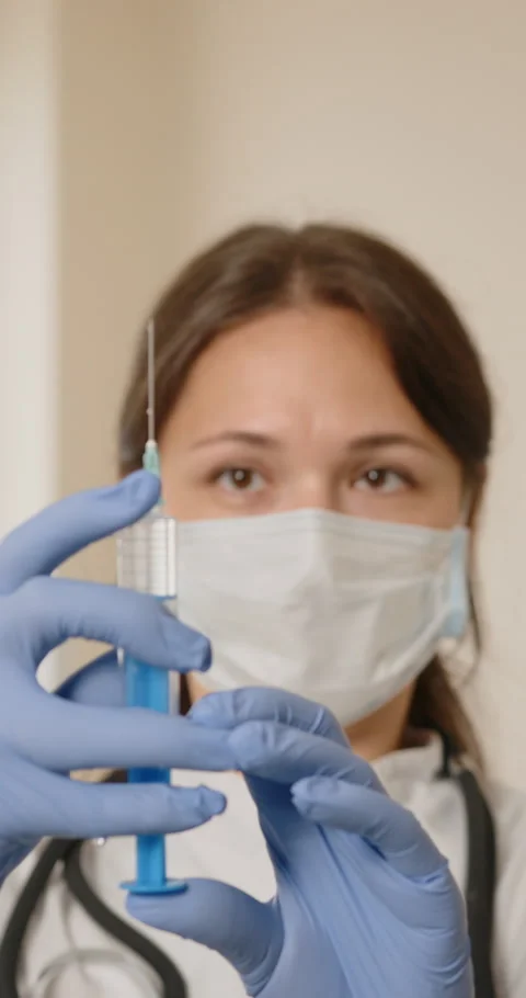 Doctor Preparing a Syringe Stock Footage 320082529