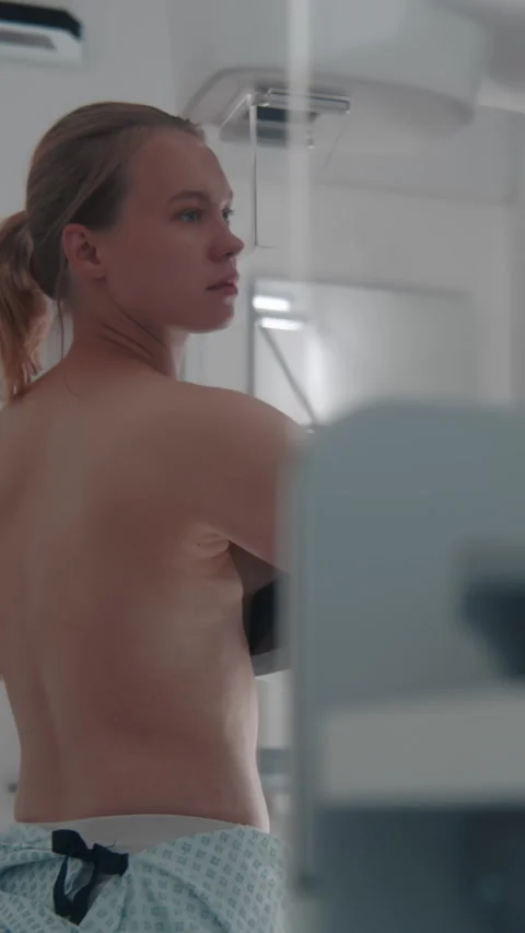 Doctor presses button to launch mammogram machine Stock Footage 275227719