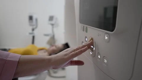 Doctor presses buttons of computer tomograph Stock Footage 260685472