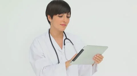 Doctor pressing the screen of a tablet computer Video stock 10866227