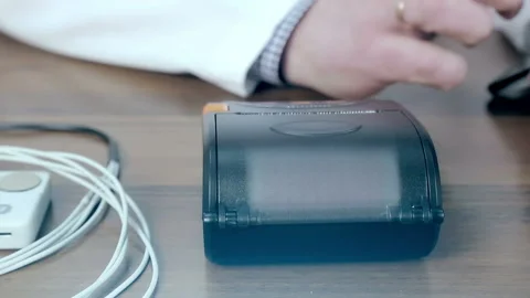 Doctor prints on the ECG ECG printer close-up Video stock 88698014