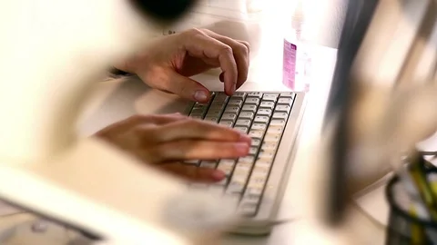 Doctor prints the text on the keyboard Stock Footage 99744600