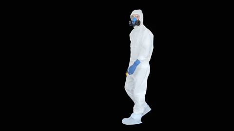 Doctor in protective suit checking your temperature, Alpha Channel Stock Footage 133246184