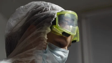 Doctor in protective suit during work Video stock 129226001