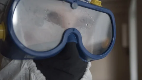 Doctor in a protective suit. hard work of a doctor.  Stock Footage 127748502