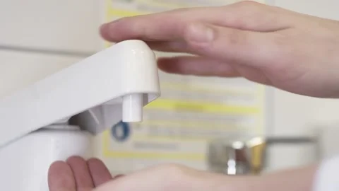 Doctor pumping disinfectant in his hand Stock Footage 132713853