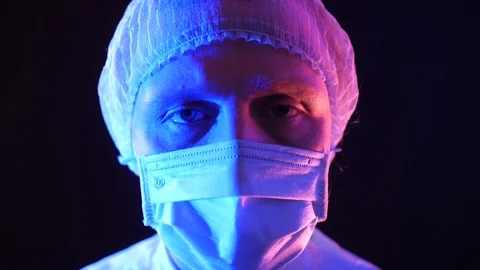 Doctor put protective goggles on. Stock Footage 127063105