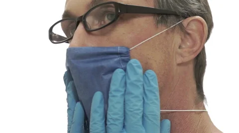 Doctor Puts on Face Mask Side View Stock Footage 44379567