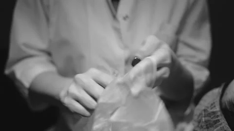 Doctor puts on gloves Stock Footage 58137294