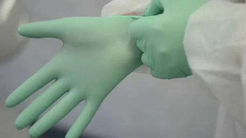 The doctor puts on gloves Stock Footage 182518256