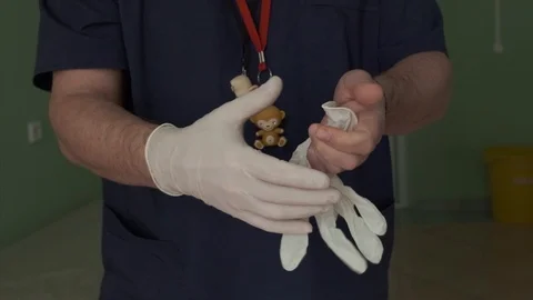 Doctor puts the medical gloves on Stock Footage