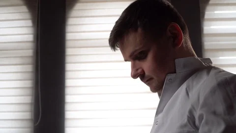 Doctor puts on a phonendoscope Stock Footage 125810000