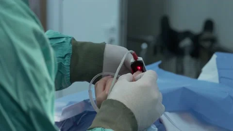 Doctor puts a pressure sensor on the finger of the patient Stock Footage 166946841