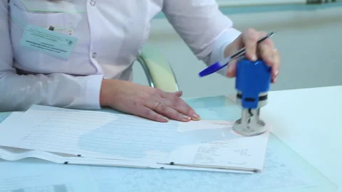 The doctor puts a stamp on the document Stock Footage 279991041