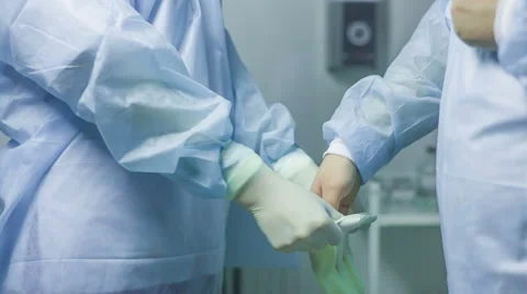 Doctor putting gloves Stock Footage 47469992