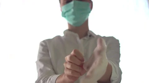 Doctor putting on gloves Stock Footage 168465682