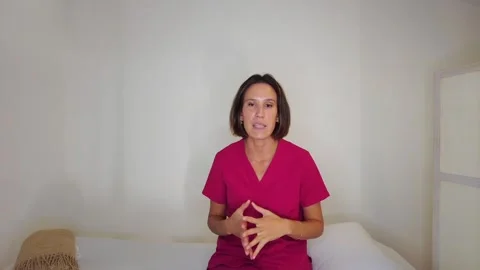 Doctor recording a tutorial of nutrition from home 스톡 동영상 252643563