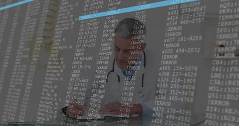 Doctor reviewing data jotting notes while error overlay scrolling indicating Stock Footage 312098310