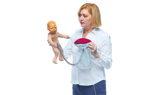 The doctor schematically on the layout shows the process of passing the child Stock Photos