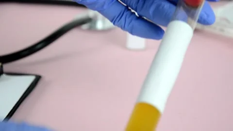 Doctor scientist holding ampoule or test tube or vaccine coronavirus covid 2019 库存影片 144123750