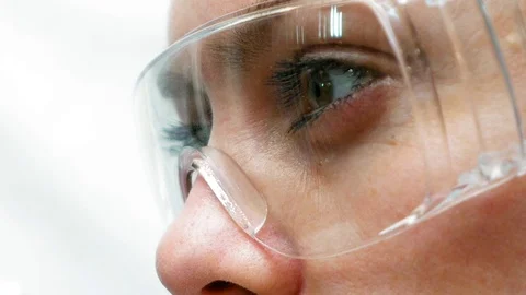 Doctor scientist looking at the test tubes in lab Stock-Footage 69980064