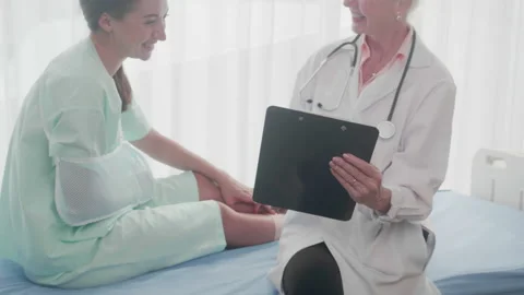 Doctor senior specialist checking document and explaining about diagnosis inj Stock Footage 149383326